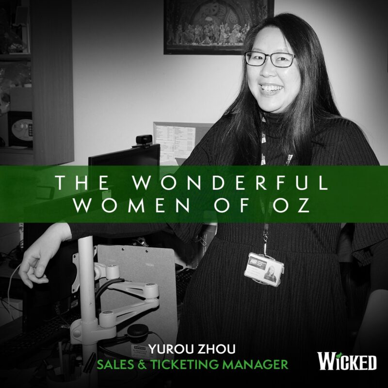 An image of Yurou Zhou, Sales and Ticketing Manager standing backstage. We see the text "The Wonderful Women of Oz"