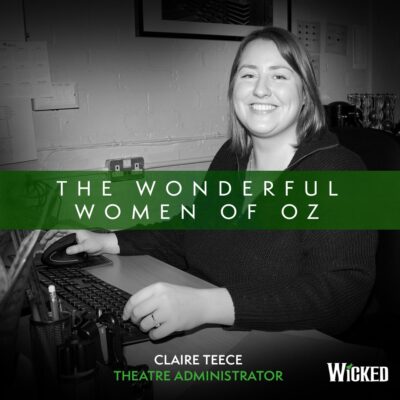 An image of Claire Teece, Theatre Administrator sitting at her desk. We see the text "The Wonderful Women of Oz"